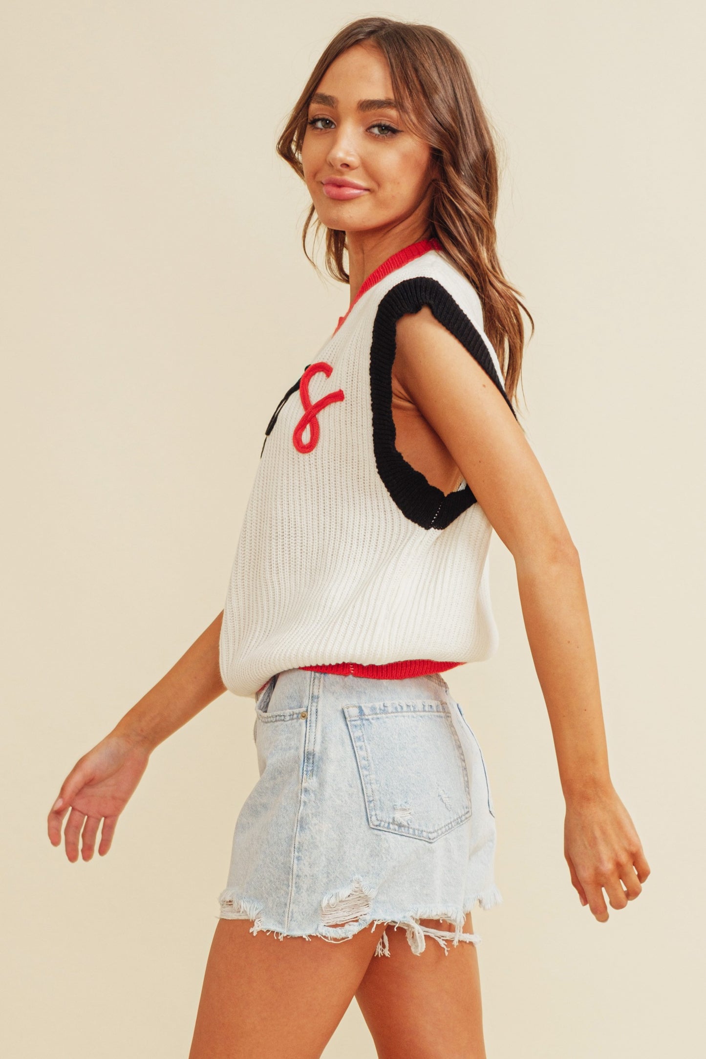 'DAWGS" EMBROIDERED COLORBLOCK SLEEVELESS SWEATER TOP. Side view.