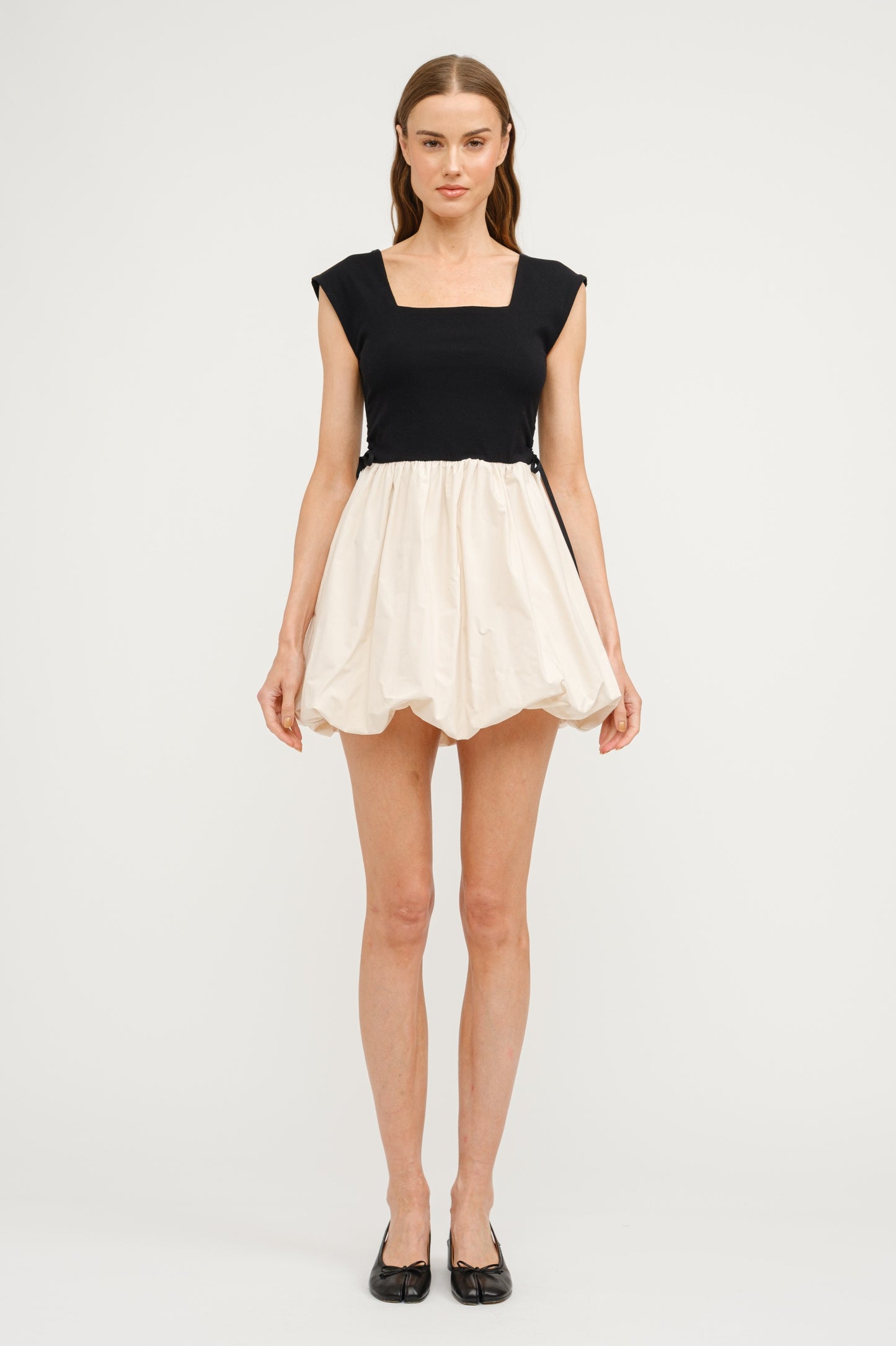 Combination Bubble Hem Dress - Black & Natural. Front full view.