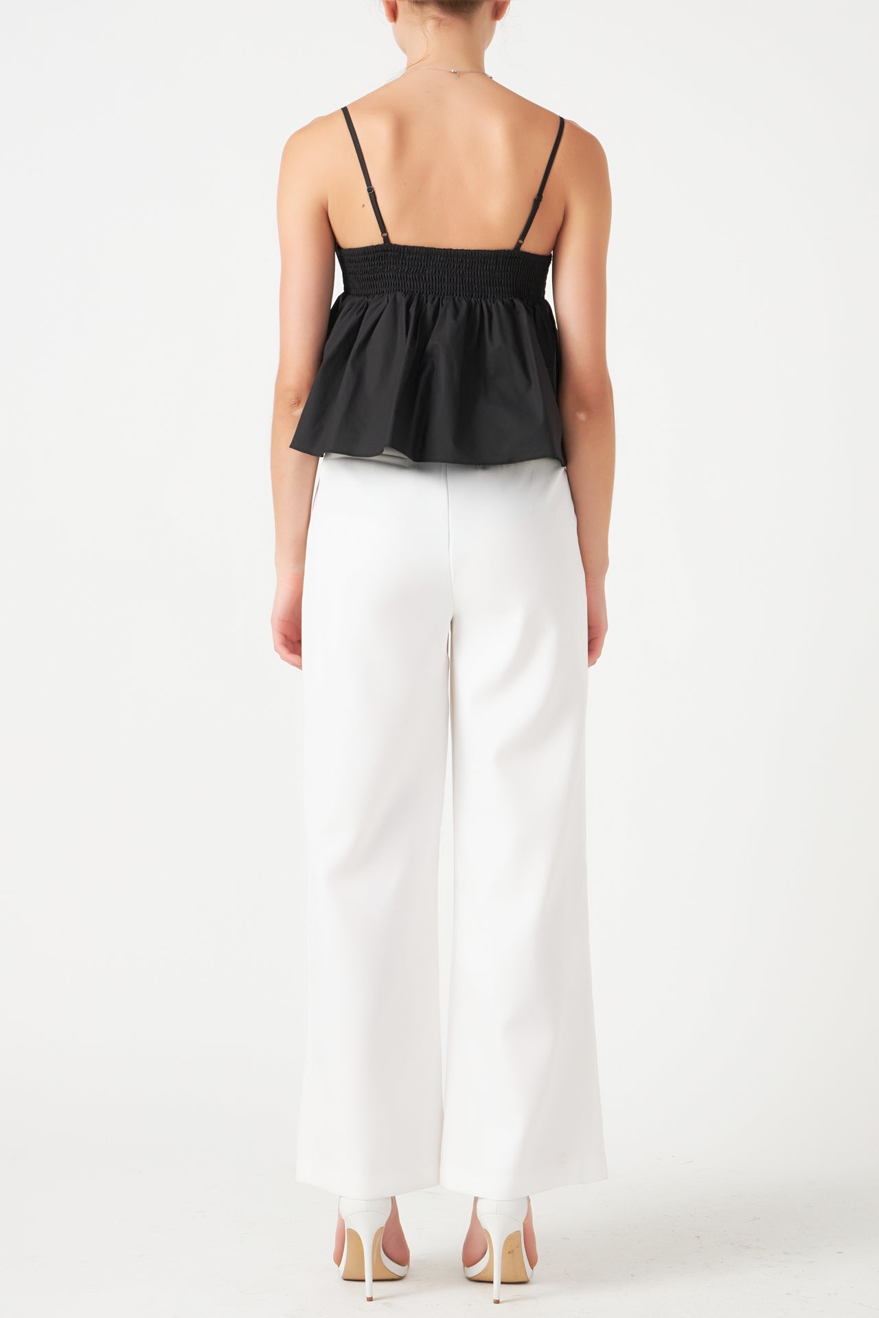 Bow Peplum Top - Black. back view.