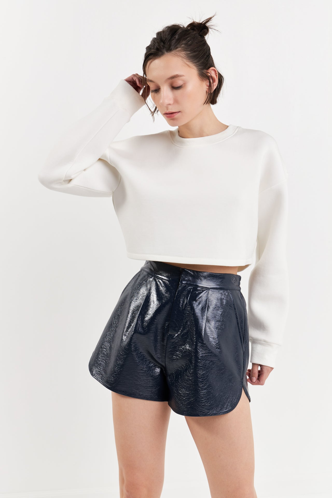 High-Waisted Faux Leather Shorts - Navy. Front close view.