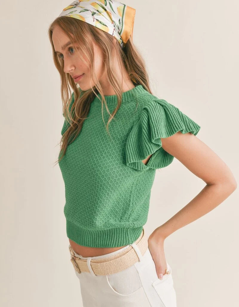 Crochet knit top featuring ruffle sleeves. Green. Side view.
