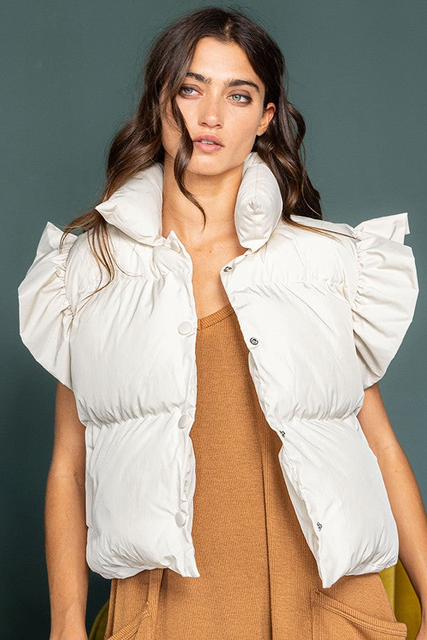 Ruffle sleeve crop down vest in cream.  Front view.