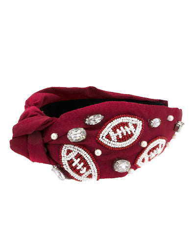 Maroon headband with white beaded footballs, pearls, and crystals.