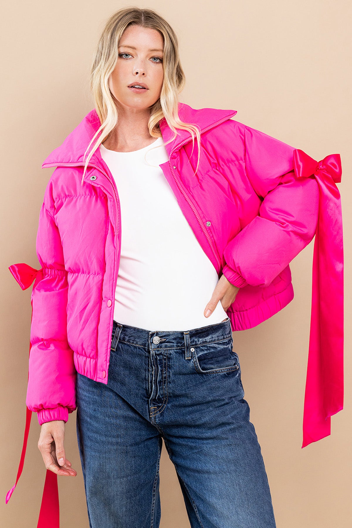 Collared, puffer jacket in fuchsia  with bow knot elbow string.  open view