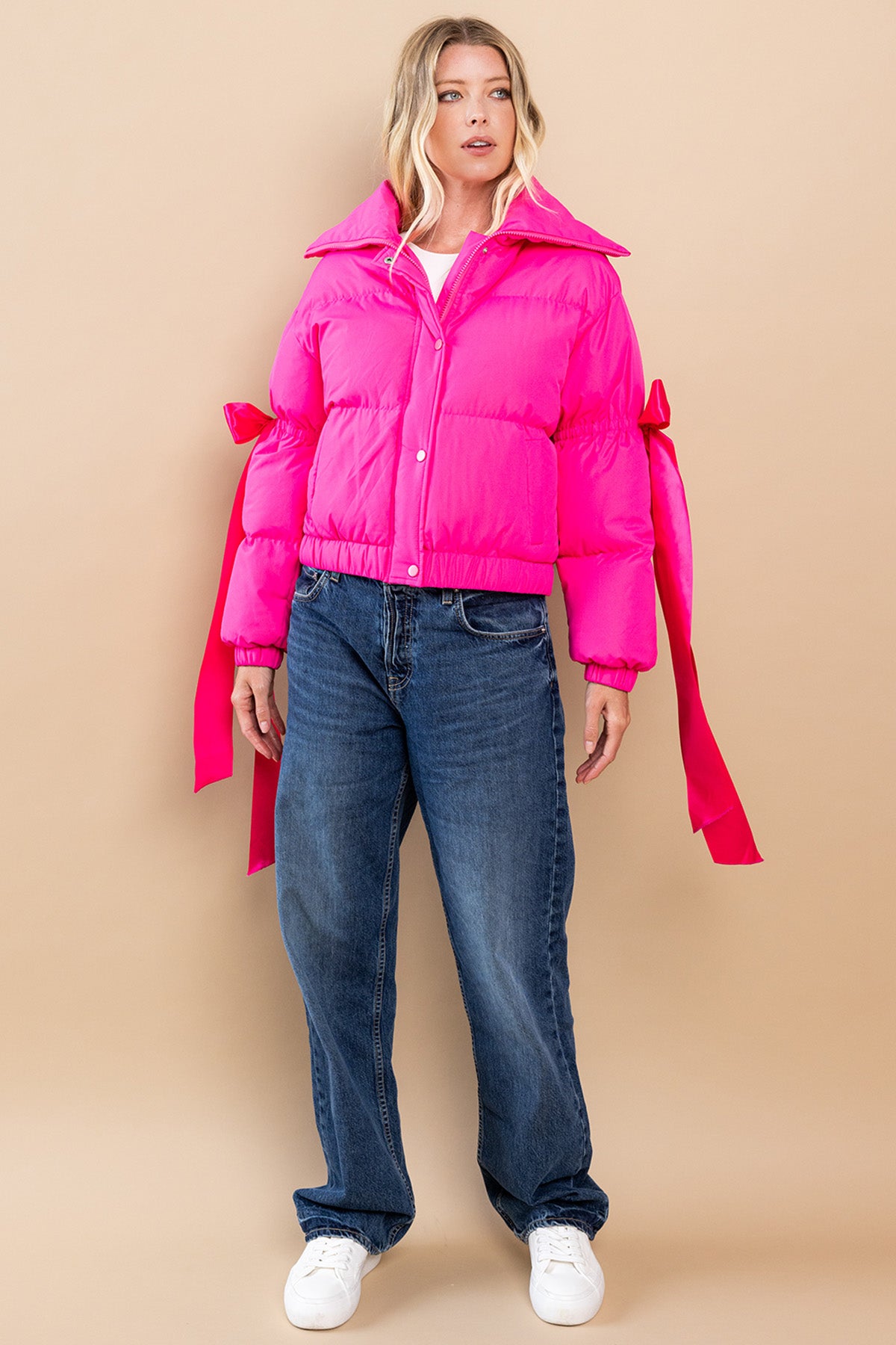 Collared, puffer jacket in fuchsia  with bow knot elbow string.  full view