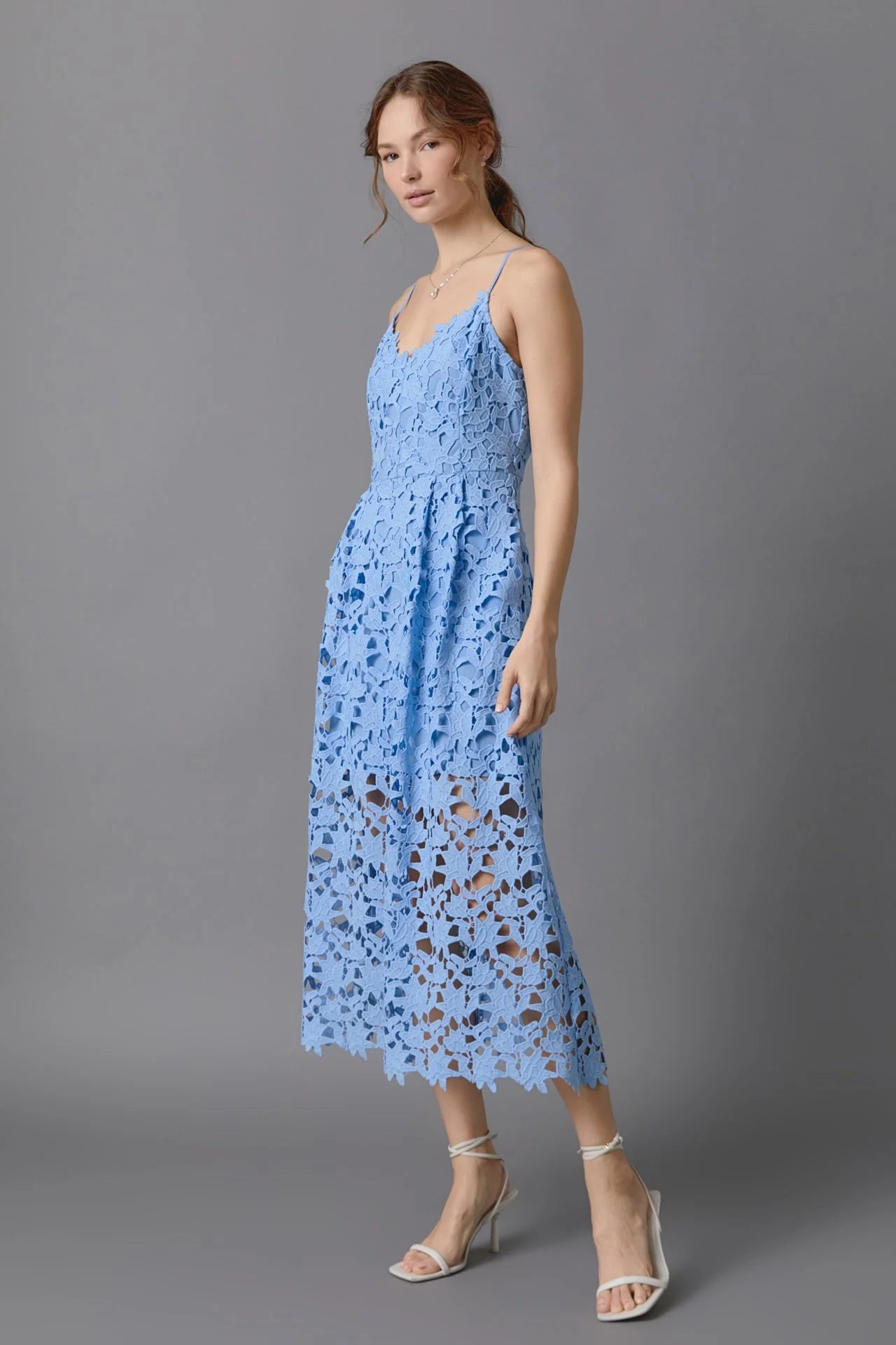 Lace overlay mini dress in powder blue. Side full view.