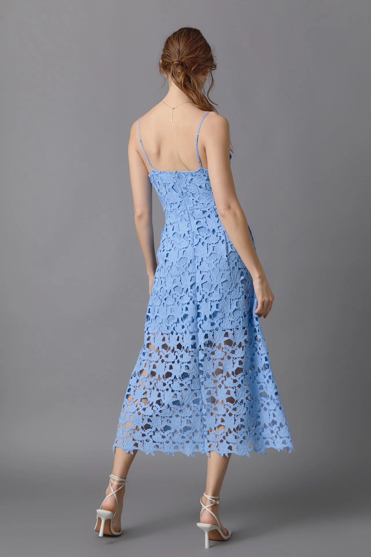 Lace overlay mini dress in powder blue. Back full view.