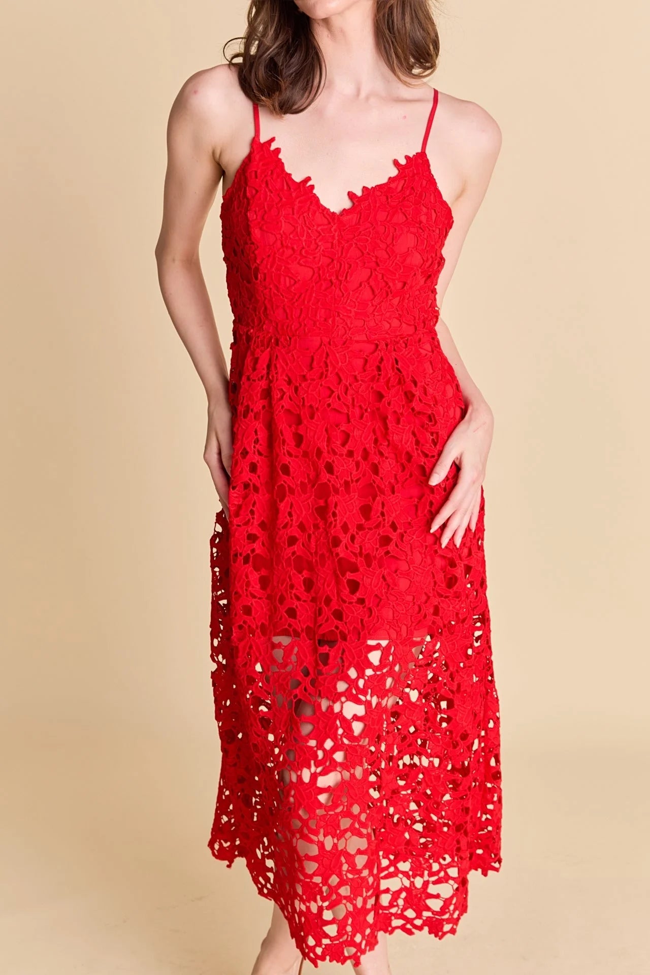 Lace overlay mini dress in red. Front close view.