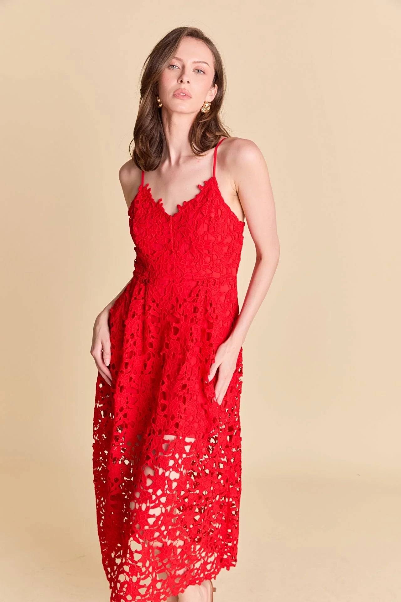 Lace overlay mini dress in red. Front close view.