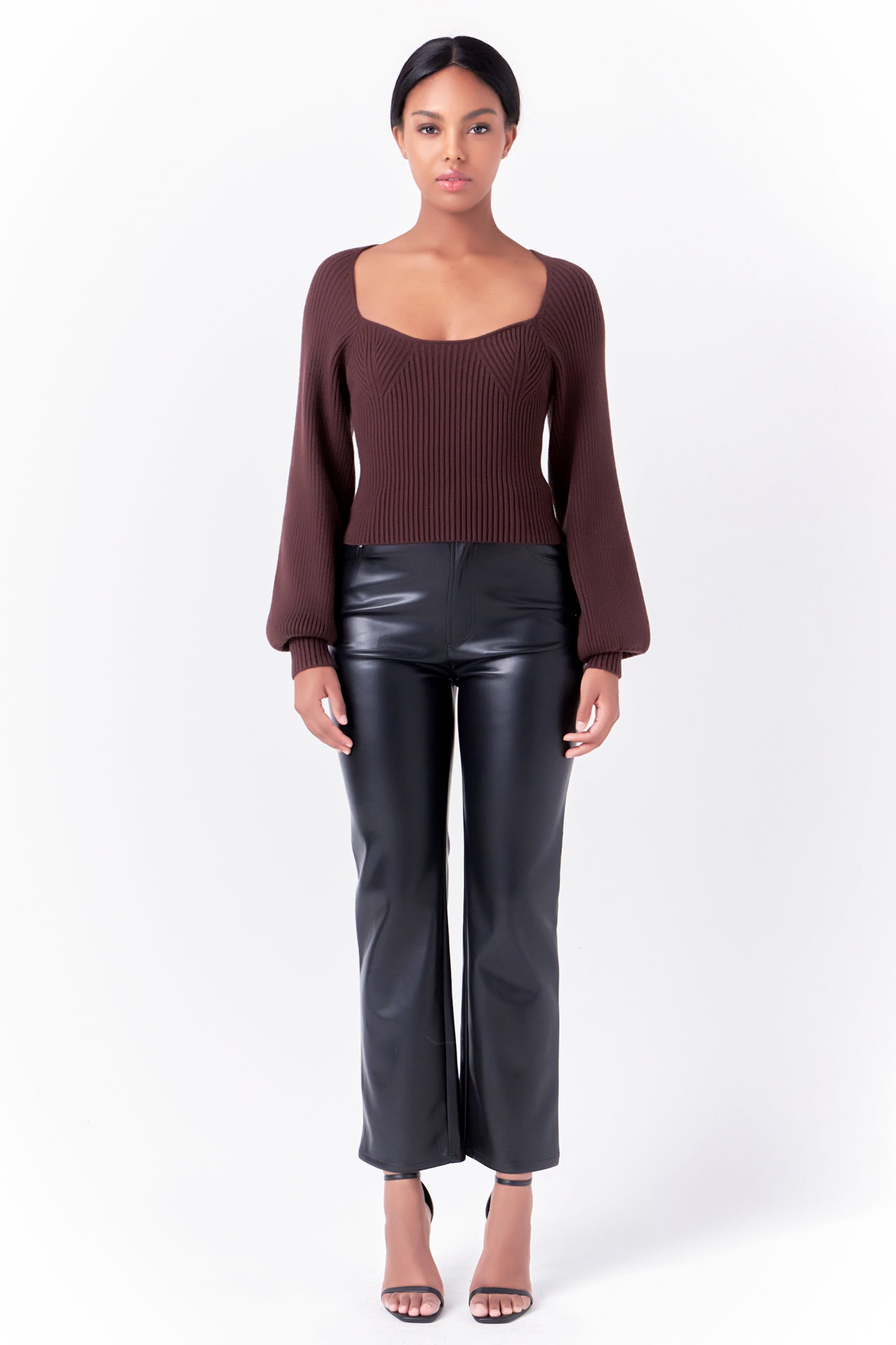 Knitted top in chocolate featuring square neckline, ribbed detailing, balloon sleeves. Front full view.