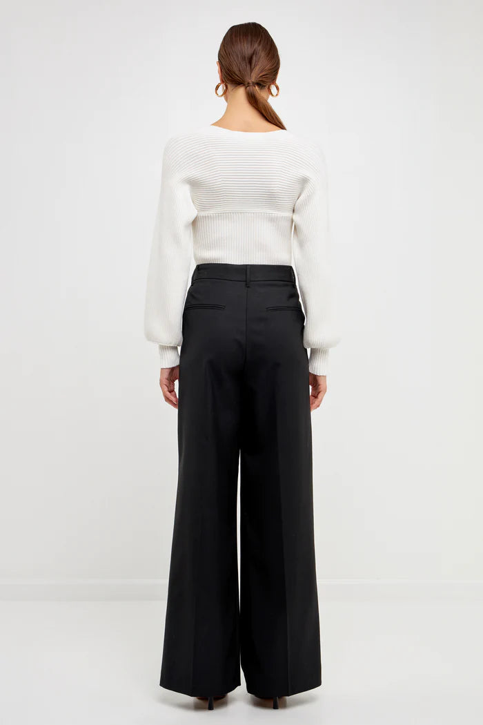 Knitted top in white featuring square neckline, ribbed detailing, balloon sleeves. back full view.