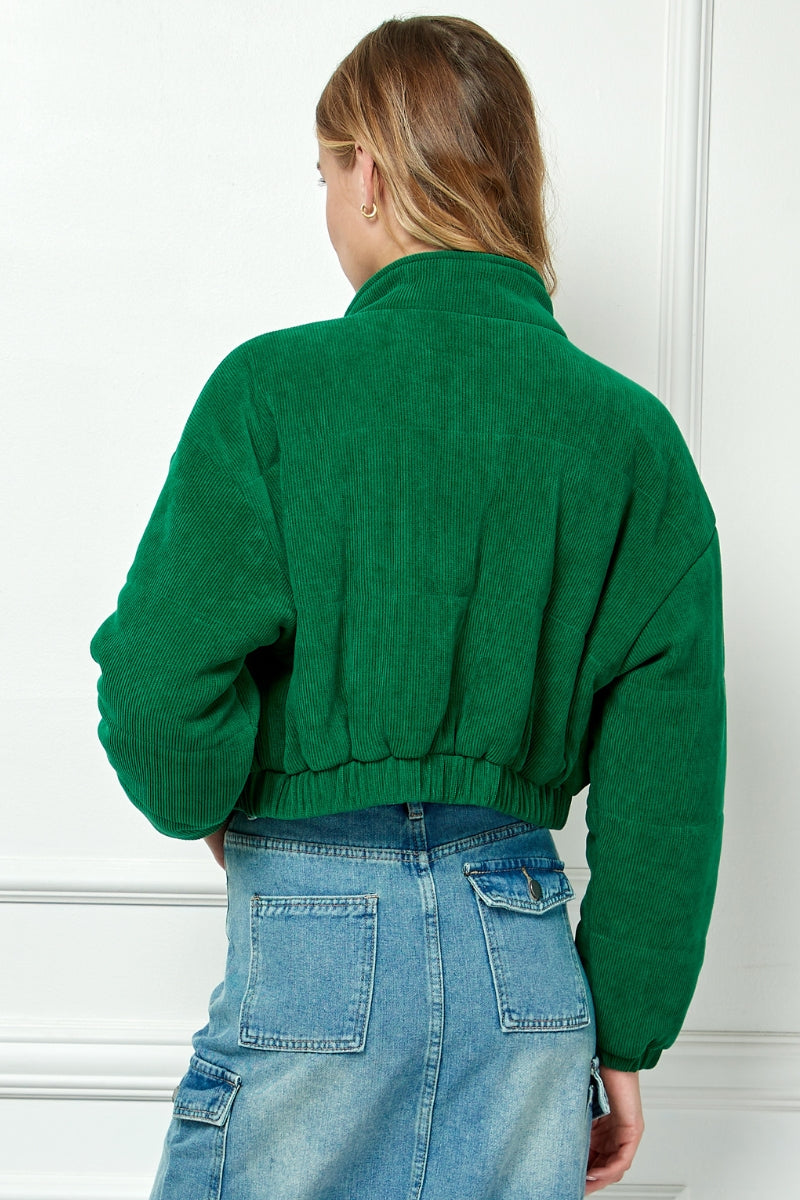 Corduroy short bomber jacket in green featuring button and zippered front closure.  Back view.