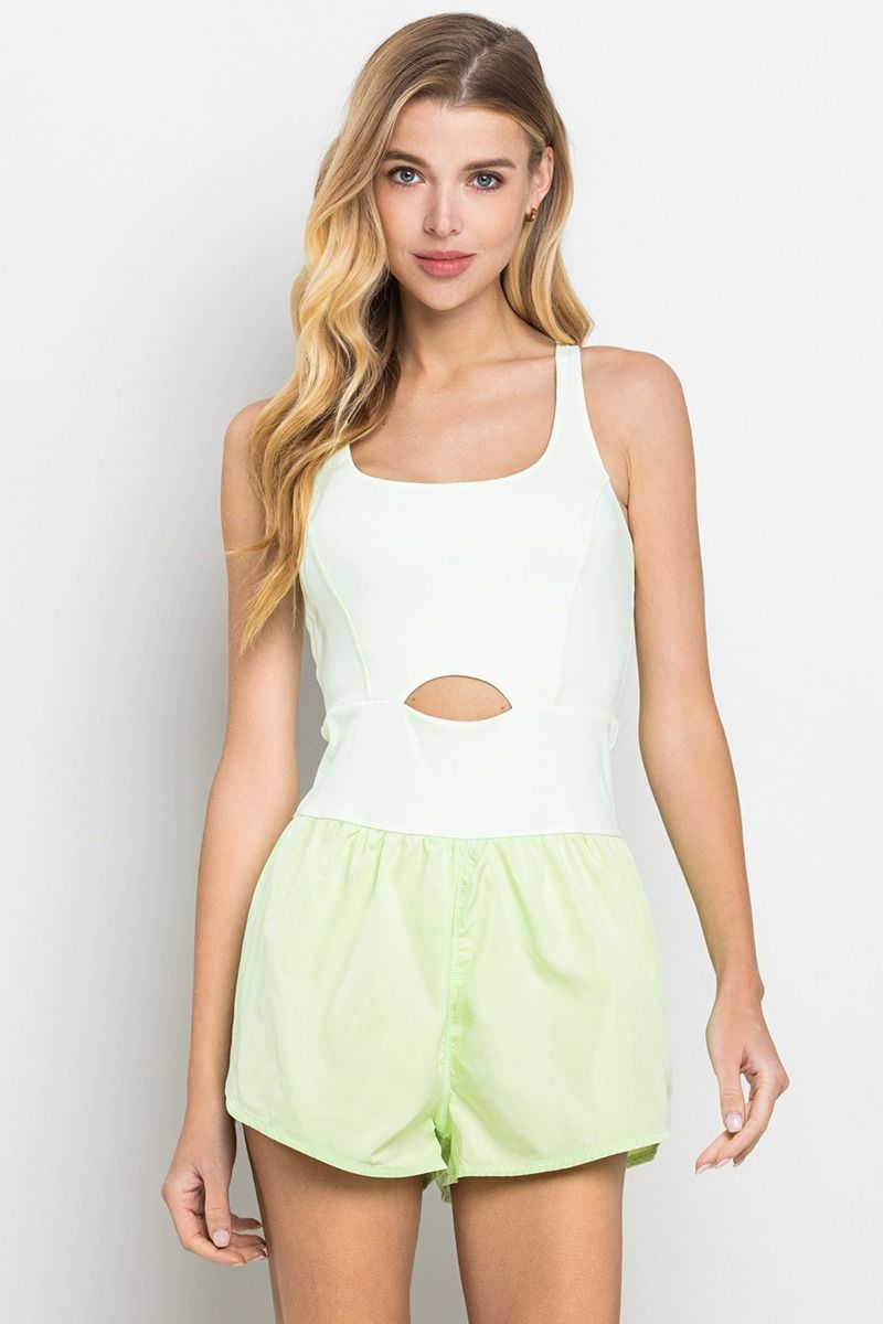 A sleeveless athletic romper in lime green with a small center cut out, and an elastic waistband.  Front view.