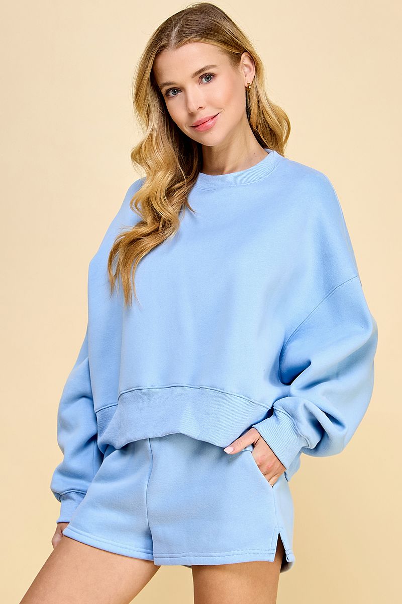 Matching sweat shirt & shorts set in Baby Blue.  Front view.