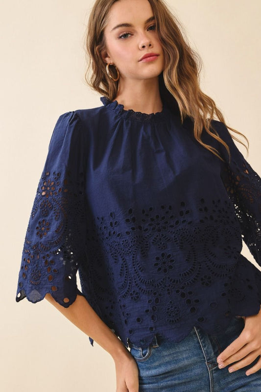 Floral eyelet embroidery 3/4 sleeve top.  Front close view. 