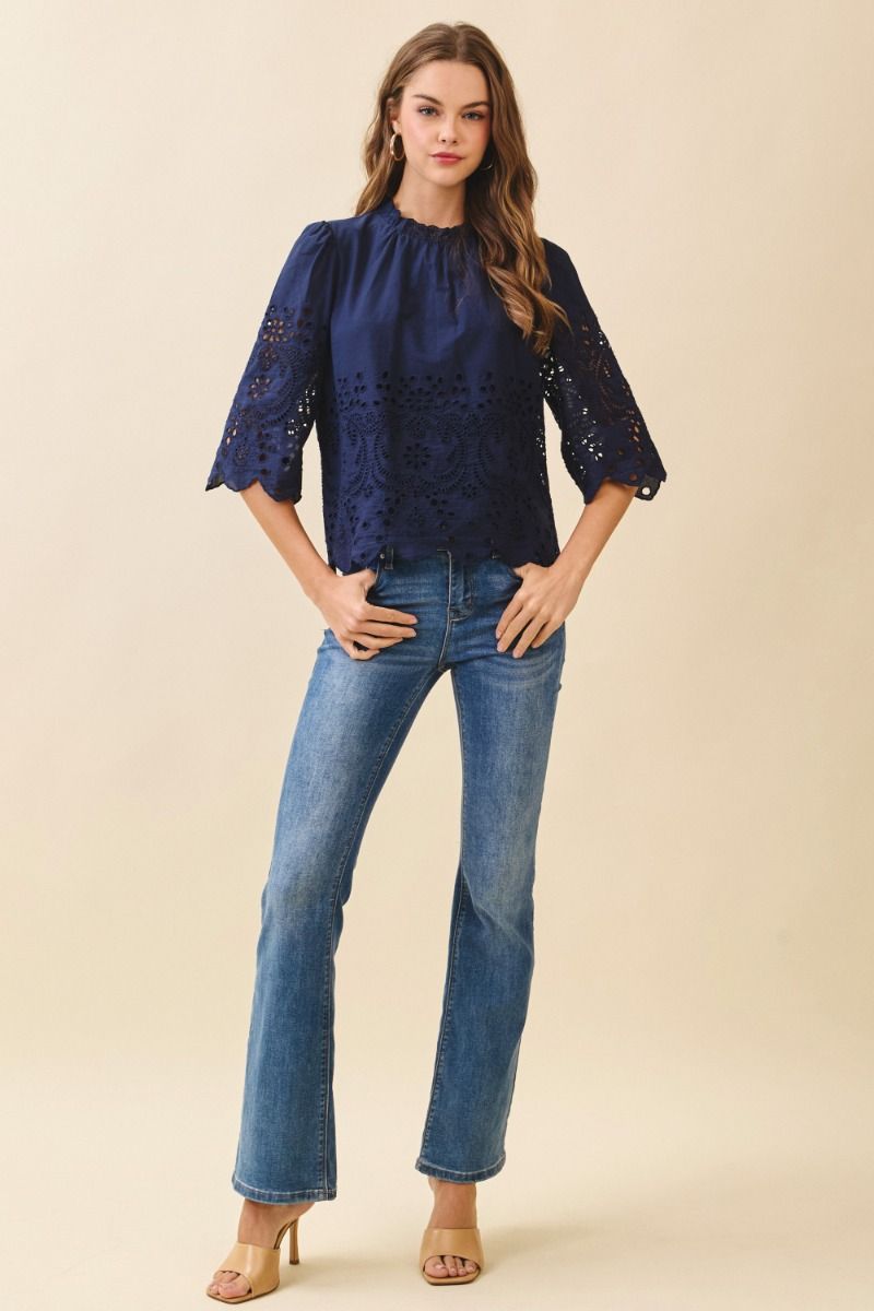 Floral eyelet embroidery 3/4 sleeve top.  Front full view.