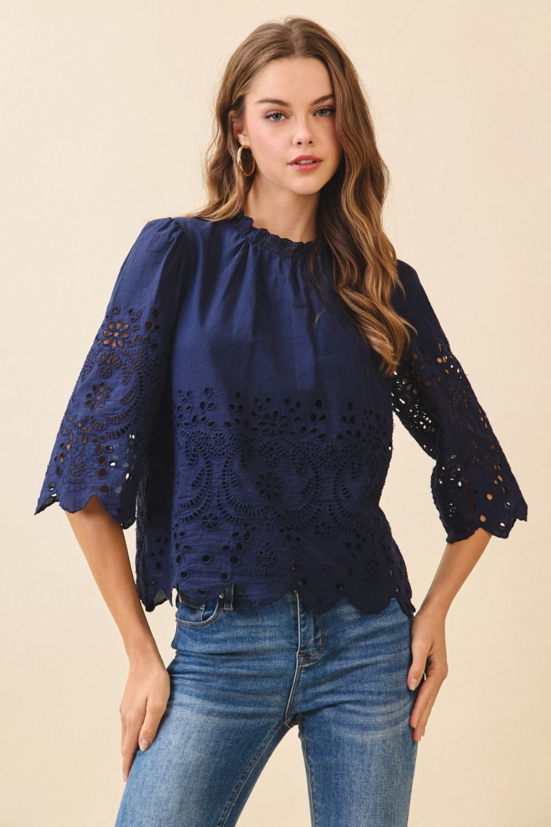 Floral eyelet embroidery 3/4 sleeve top.  Front close view.