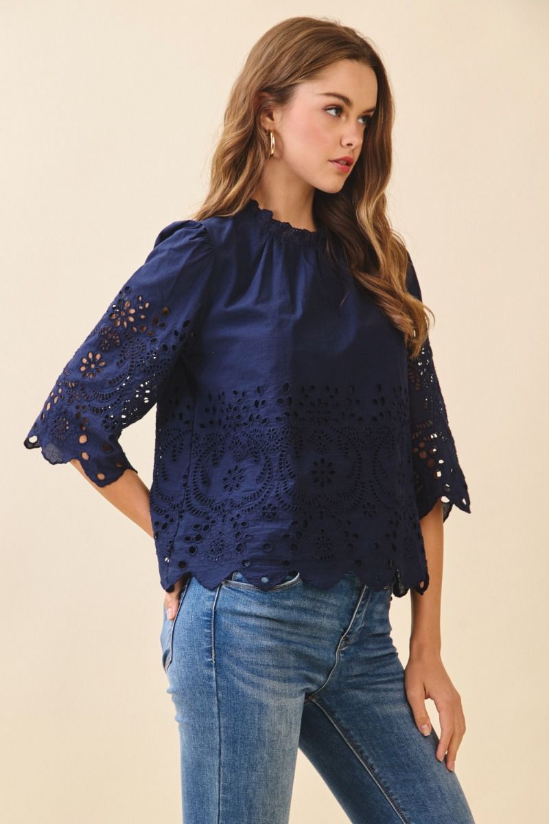 Floral eyelet embroidery 3/4 sleeve top.  Side close view.