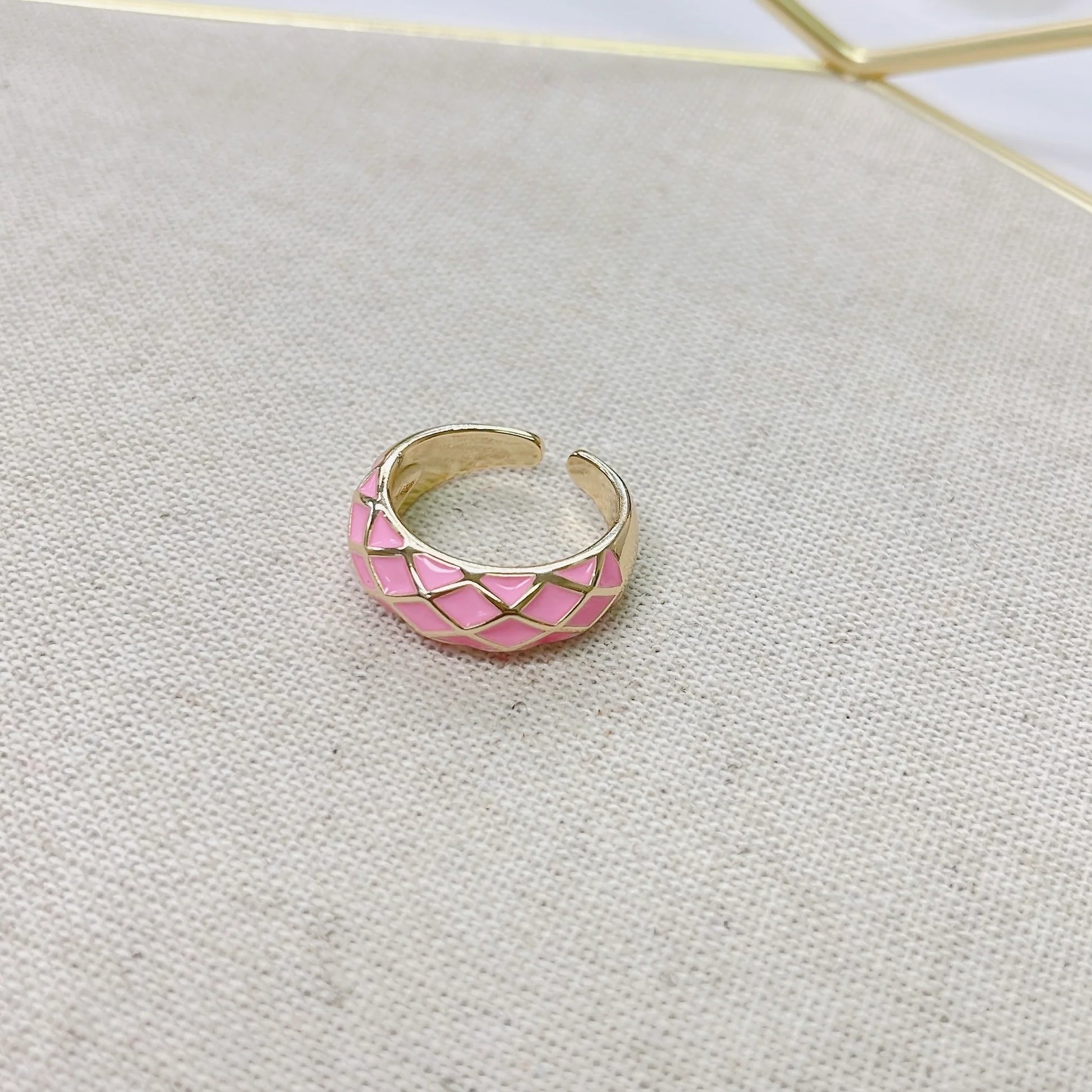 Diamond chevron design pink and gold ring.  Adjustable.
