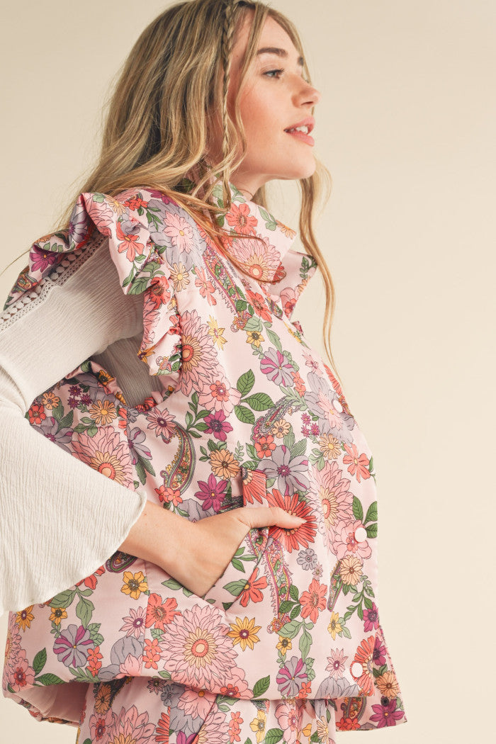 Floral Puffer Vest in Pink with flutter sleeves.  Side view.