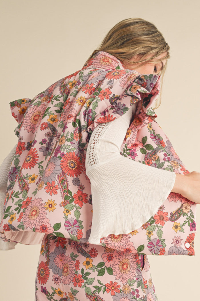 Floral Puffer Vest in Pink with flutter sleeves.  Back view.
