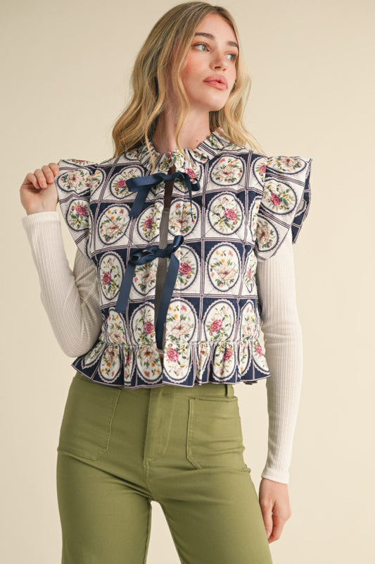 Floral Puffer Vest With Ruffle Sleeves - Navy.  Front close view.