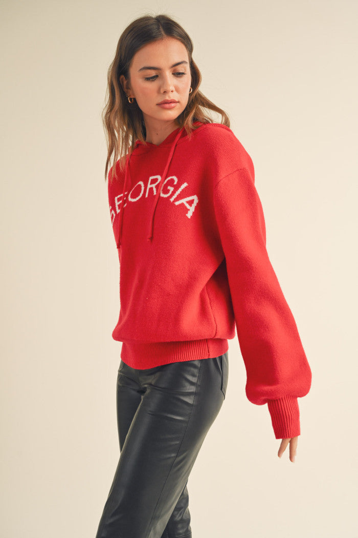 "Georgia" Hoodie Sweater - Red with white.  Puff sleeves, drawstring hoodie, soft oversized knit.  Side view.