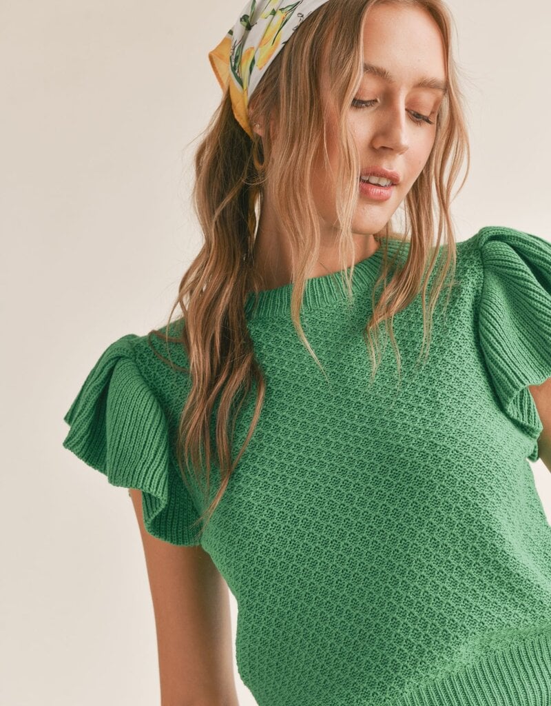 Crochet knit top featuring ruffle sleeves.  Green.  Front close view.